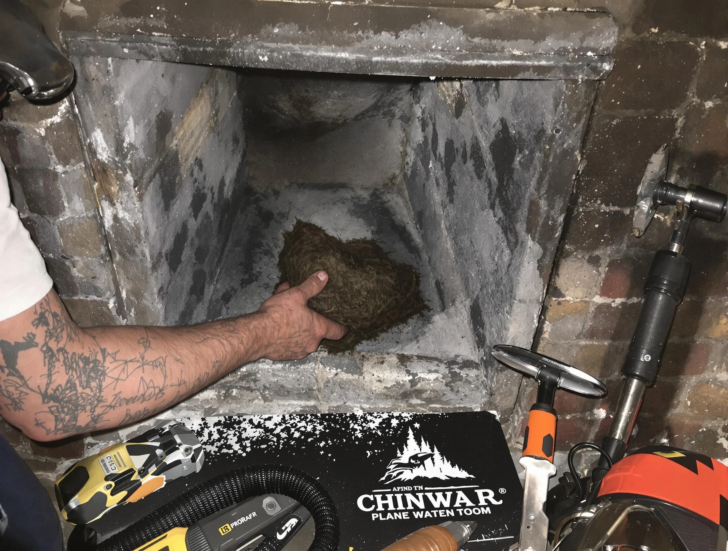 Brick Chimney Sweep safely removing debris and screening chimney in Brick, NJ